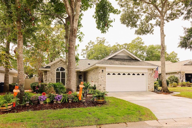 single story home with a garage and a front lawn