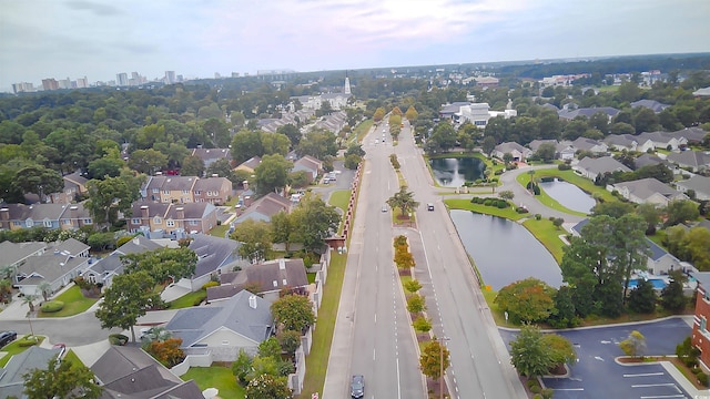 drone / aerial view with a water view