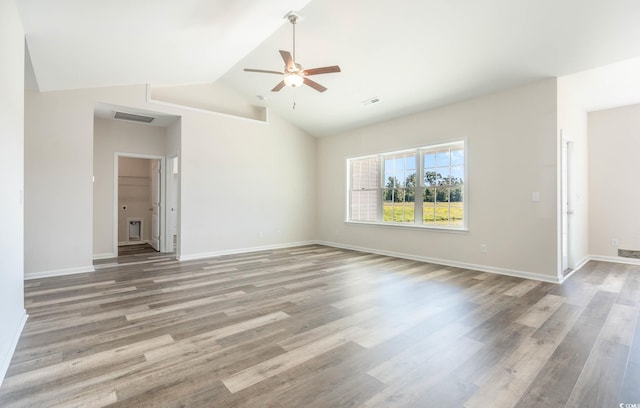 unfurnished room with vaulted ceiling, ceiling fan, and hardwood / wood-style flooring