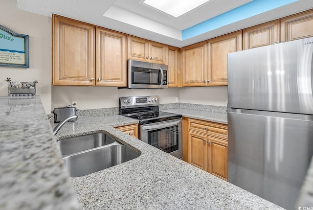 5308 N Ocean Blvd Unit 812, Myrtle Beach, SC 29577 - kitchen featuring stainless steel appliances, a sink, light stone counters, and a tray ceiling