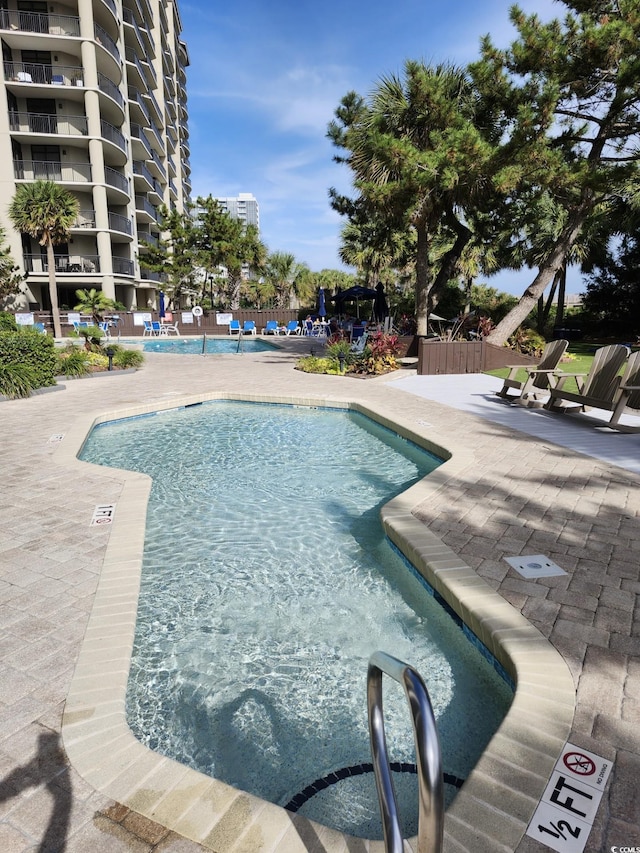 5308 N Ocean Blvd Unit 812, Myrtle Beach, SC 29577 - community pool featuring a patio