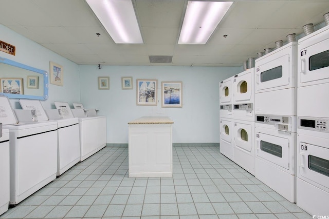 5308 N Ocean Blvd Unit 812, Myrtle Beach, SC 29577 - shared laundry featuring stacked washer / dryer, independent washer and dryer, baseboards, and light tile patterned floors
