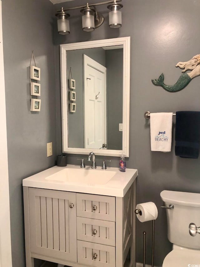 bathroom with vanity and toilet