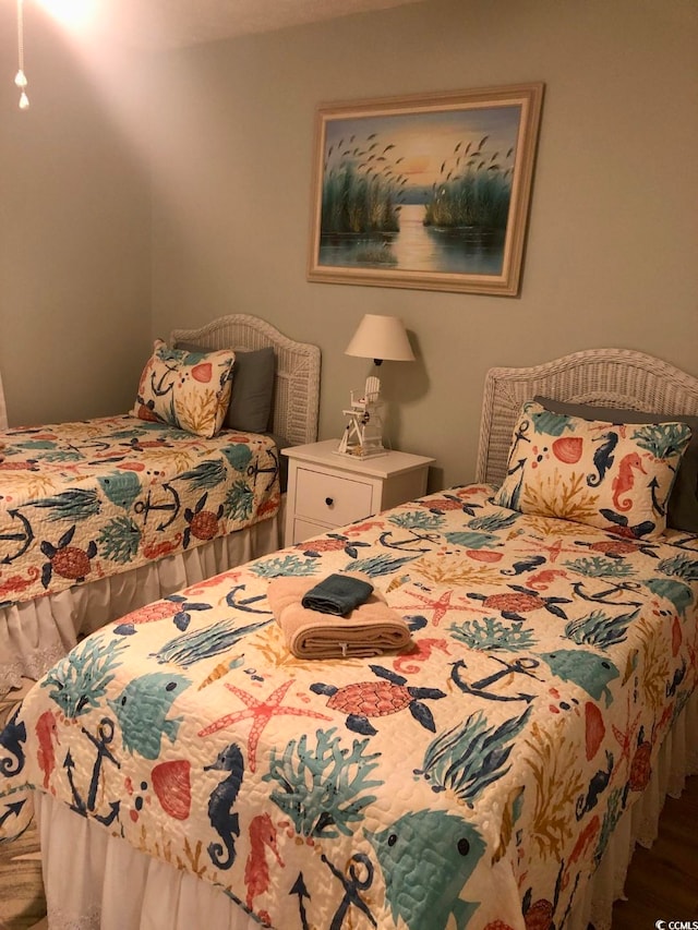 bedroom with hardwood / wood-style floors