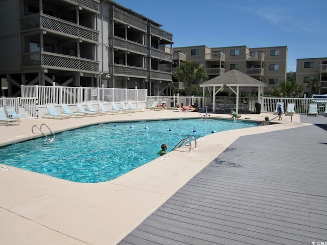 view of swimming pool with a patio and a gazebo