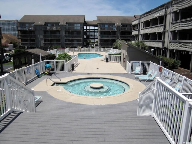 view of pool featuring a hot tub