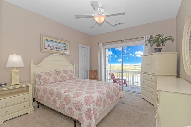 carpeted bedroom with ceiling fan, multiple windows, and access to outside