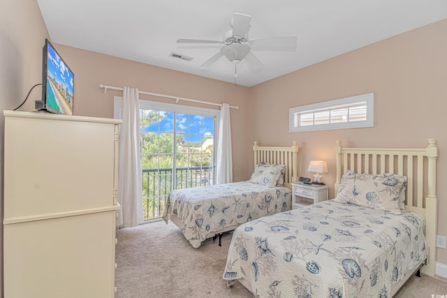 bedroom featuring multiple windows, ceiling fan, access to exterior, and light carpet