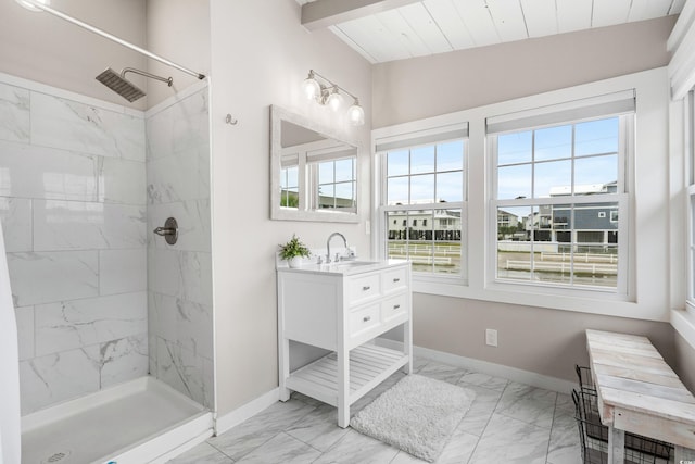 bathroom featuring wood ceiling, vanity, lofted ceiling with beams, and a tile shower