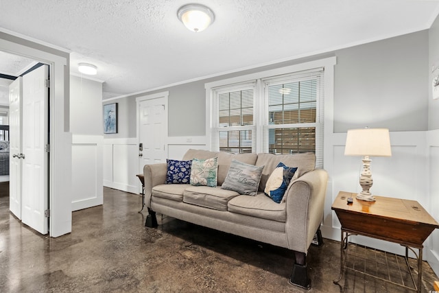 living room with crown molding and a textured ceiling