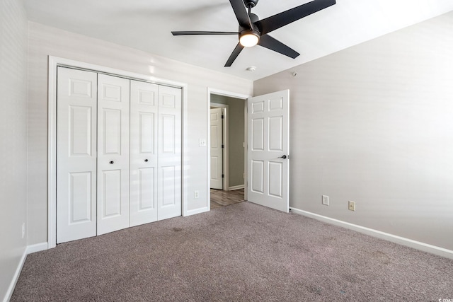 unfurnished bedroom with ceiling fan, a closet, baseboards, and carpet flooring