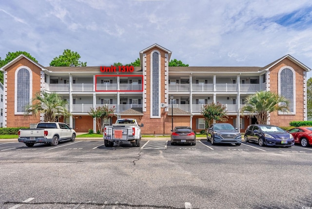 view of property with uncovered parking