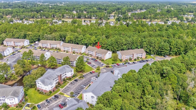 aerial view featuring a residential view and a view of trees