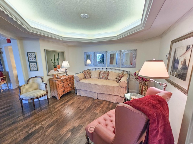 living room with a textured ceiling, a raised ceiling, crown molding, and dark hardwood / wood-style flooring