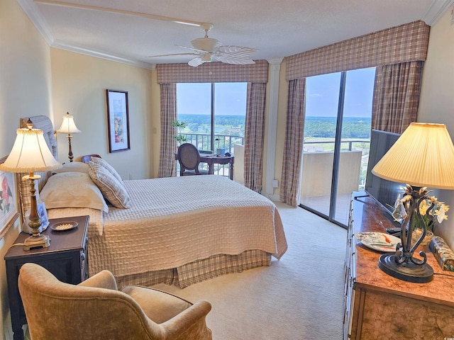 bedroom with access to exterior, a textured ceiling, crown molding, ceiling fan, and carpet