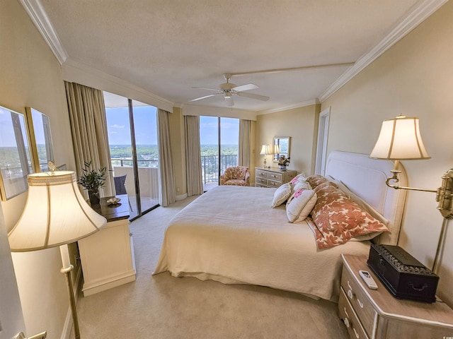 carpeted bedroom featuring ceiling fan, ornamental molding, and access to outside