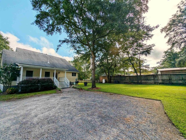 view of yard with a storage shed