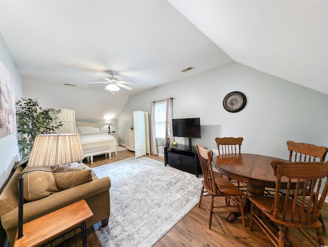 interior space with dark hardwood / wood-style flooring, ceiling fan, and lofted ceiling