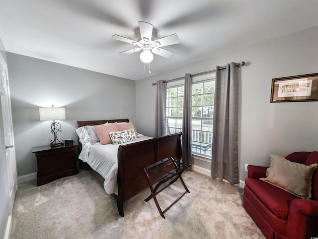 bedroom featuring light colored carpet and ceiling fan