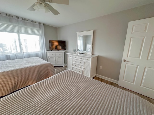 bedroom featuring hardwood / wood-style floors and ceiling fan