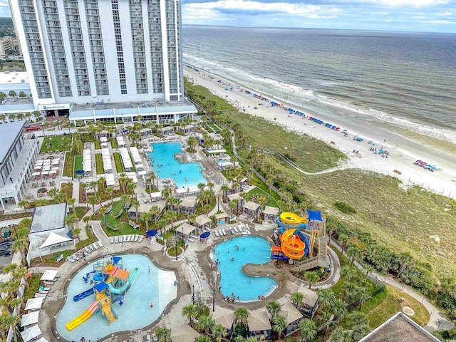 bird's eye view featuring a beach view and a water view