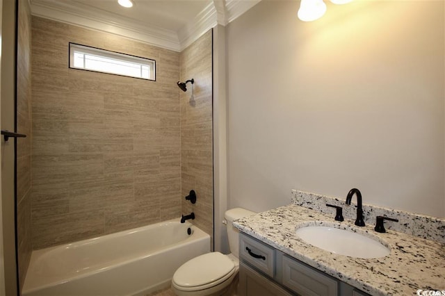 full bathroom with crown molding, tiled shower / bath, toilet, and vanity