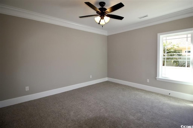 carpeted spare room featuring ornamental molding, plenty of natural light, and ceiling fan