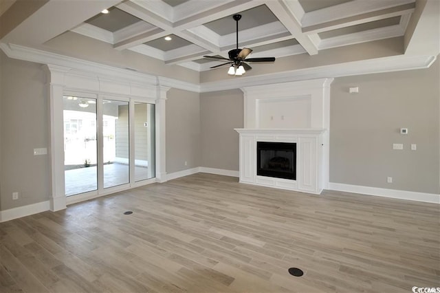 unfurnished living room with coffered ceiling, beamed ceiling, ornamental molding, ceiling fan, and light wood-type flooring