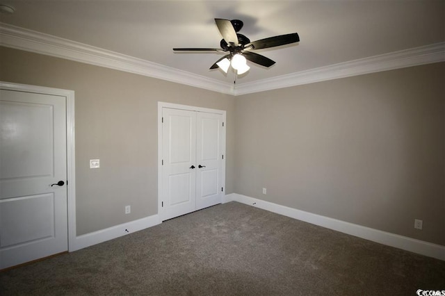 unfurnished bedroom featuring crown molding, a closet, ceiling fan, and carpet floors