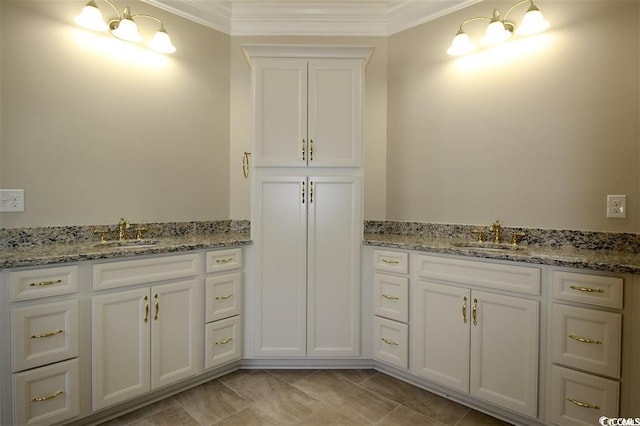 bathroom with ornamental molding, sink, and tile patterned floors