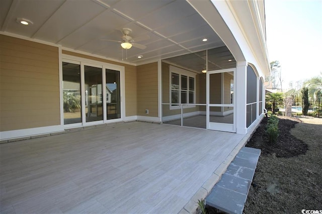 exterior space featuring ceiling fan