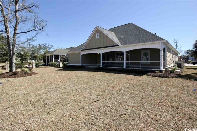 back of house with a sunroom and central air condition unit