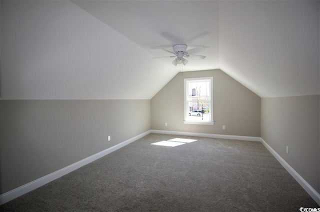 bonus room with vaulted ceiling, ceiling fan, and carpet floors