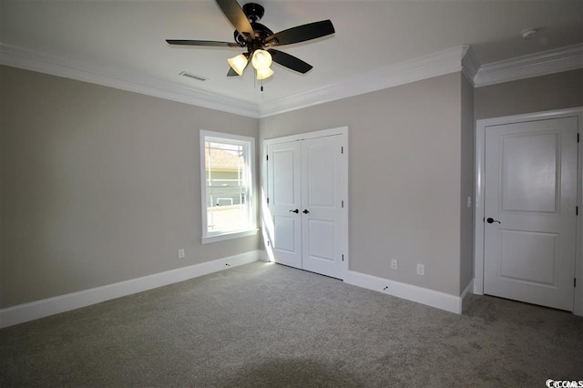 unfurnished bedroom featuring carpet, ornamental molding, and ceiling fan