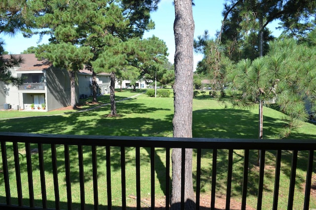 view of yard with a balcony