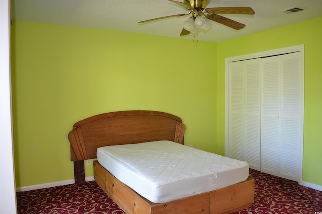 bedroom featuring ceiling fan and a closet