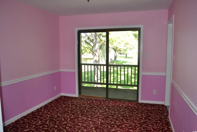 spare room featuring a textured ceiling