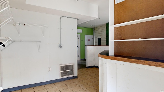 interior space featuring light tile patterned floors