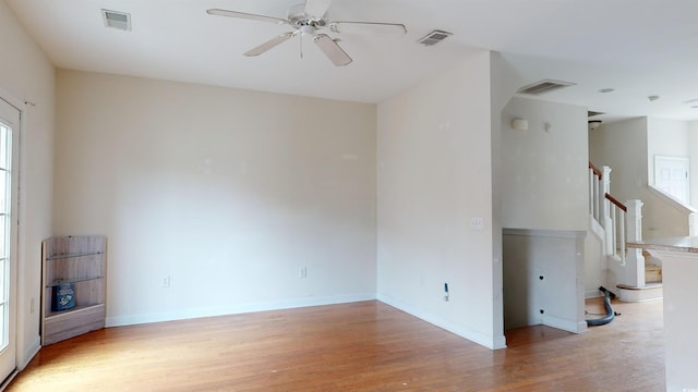 spare room featuring ceiling fan and light hardwood / wood-style floors