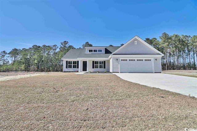 view of front facade with a garage and a front lawn