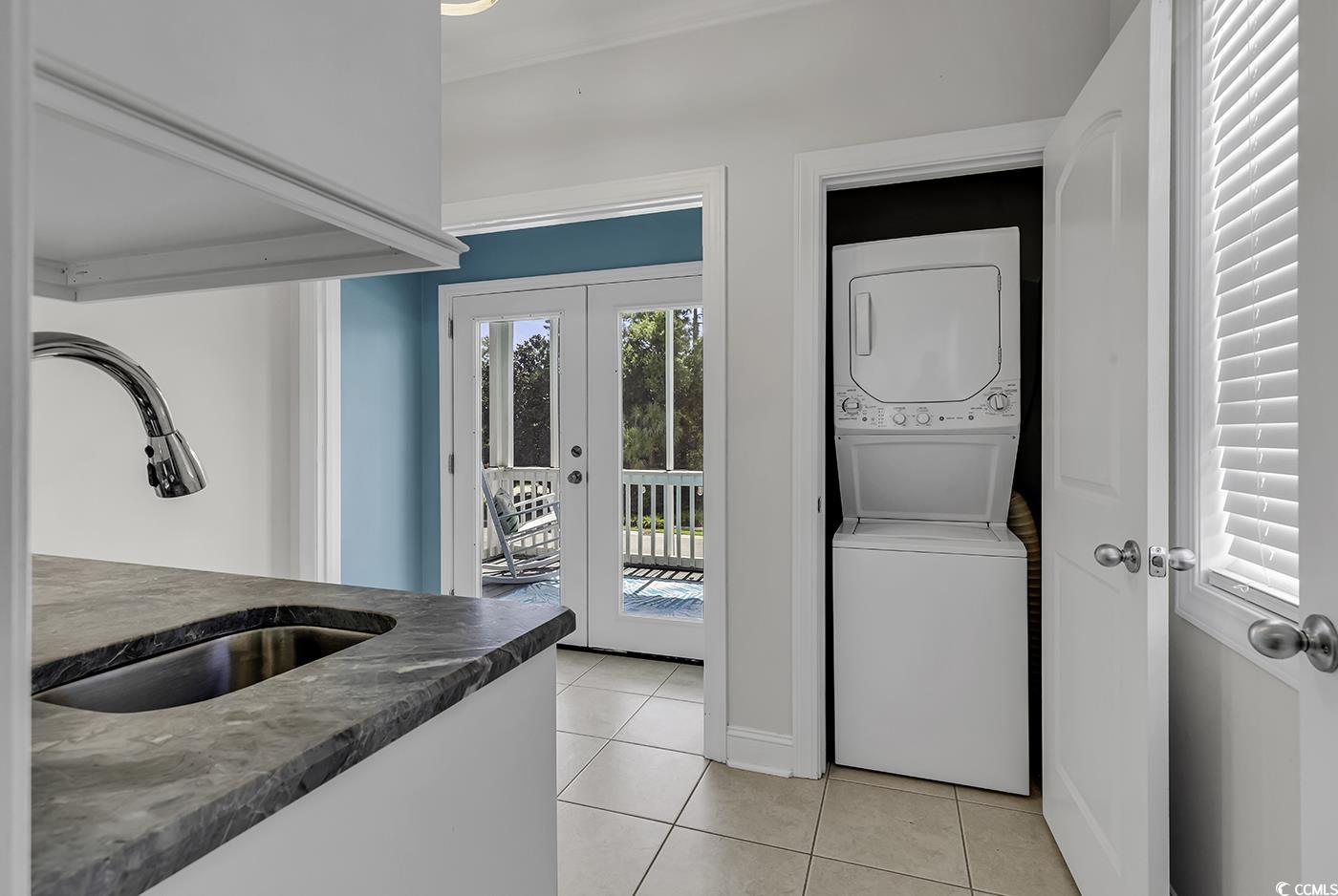 bathroom with vanity, toilet, and tile patterned flooring