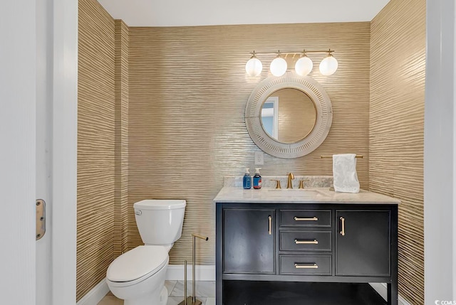 bathroom featuring toilet and vanity