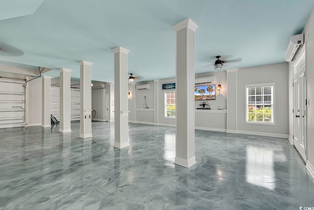 garage featuring ceiling fan and an AC wall unit