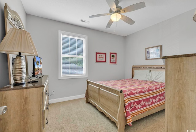 bedroom with ceiling fan and light colored carpet