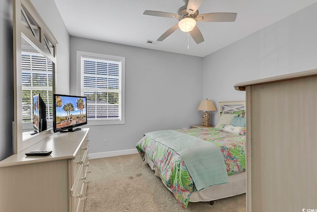 bedroom featuring ceiling fan and light colored carpet