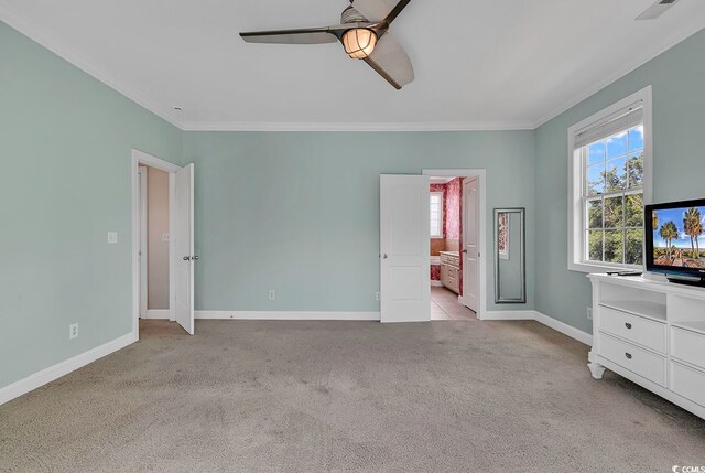 unfurnished bedroom featuring light carpet, crown molding, and ceiling fan