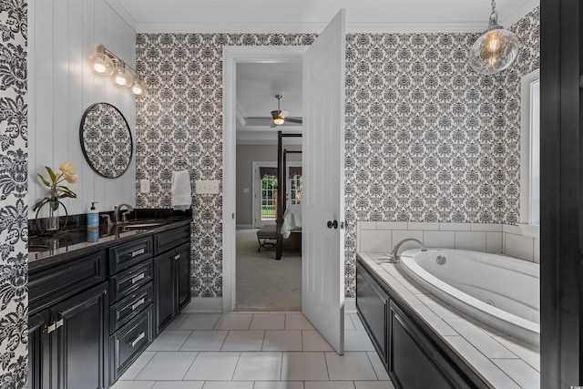 bathroom with a ceiling fan, crown molding, connected bathroom, vanity, and wallpapered walls
