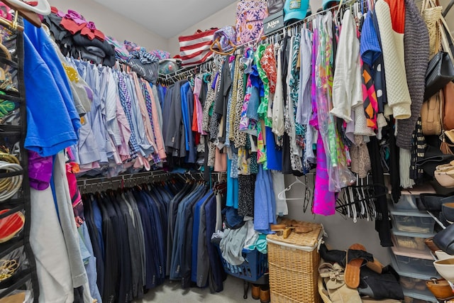 spacious closet featuring carpet flooring