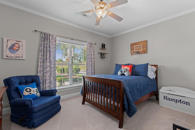 carpeted bedroom with visible vents, baseboards, ornamental molding, and a ceiling fan