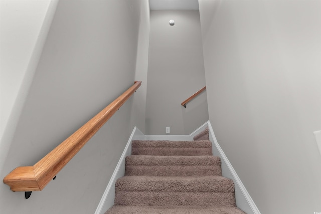 stairs featuring baseboards